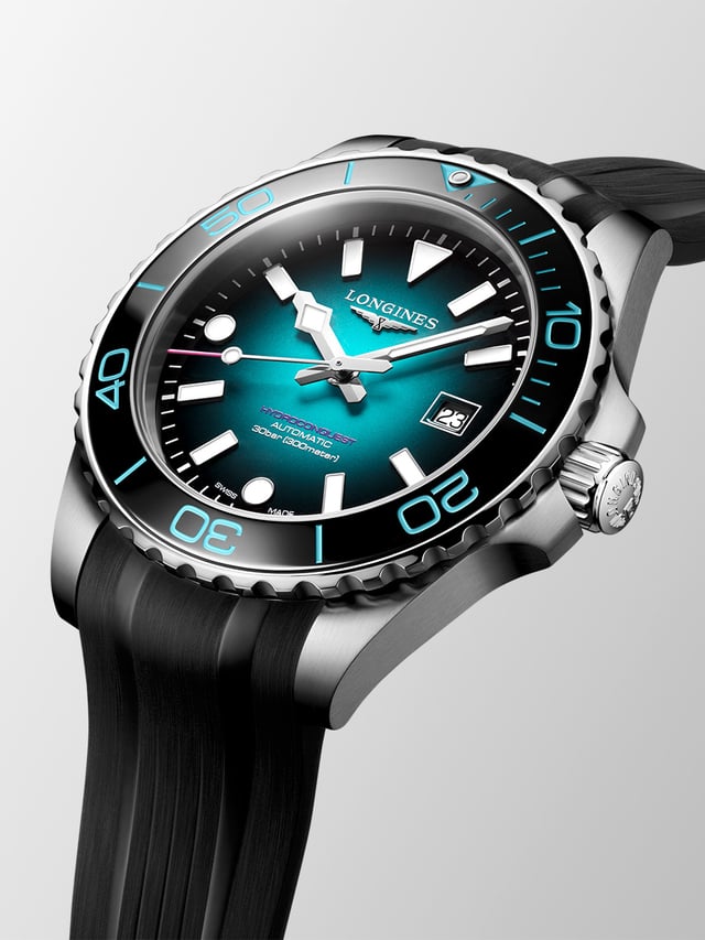 Longines HydroConquest Commonwealth Games teal-to-black gradient dial with violet signature and pink seconds hand