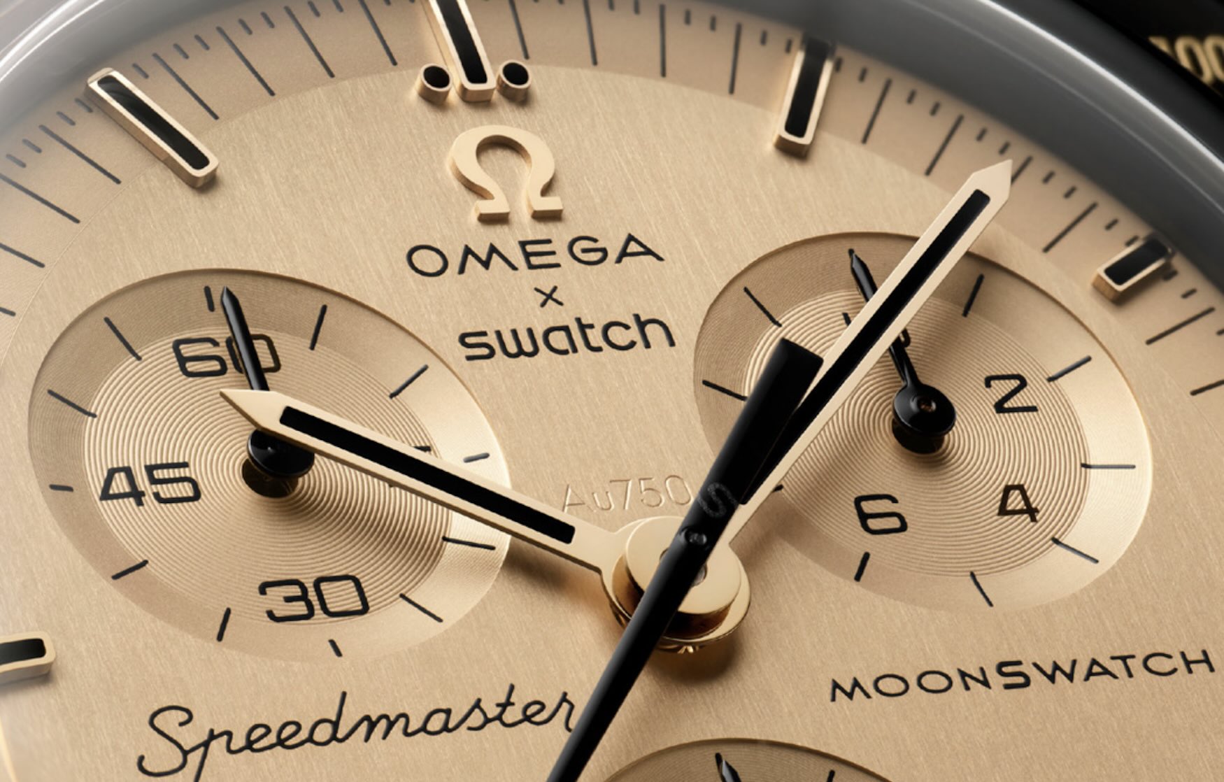 MoonSwatch Mission to the Moon 1969 on wrist — showing 42mm black Bioceramic case scale and gold accents against skin