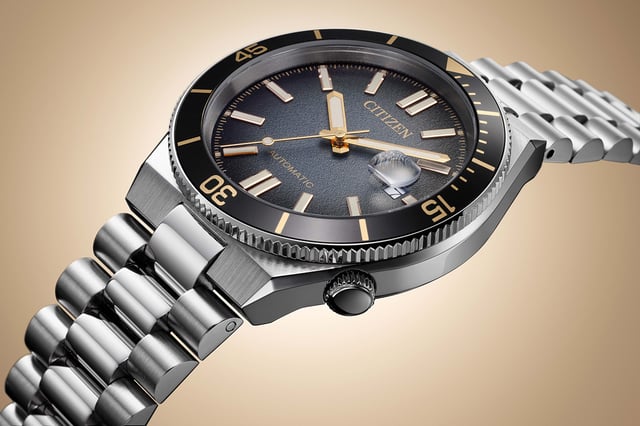Citizen Tsuyosa Shore Limited NJ0238-57E dial and case detail — gold bezel scale, rotating bezel, recessed crown at 4 o'clock