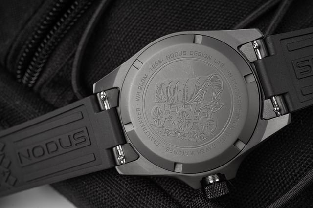 Nodus x Raven TrailTrekker Carbon caseback — screw-down steel with caravan engraving, Miyota 9075 visible