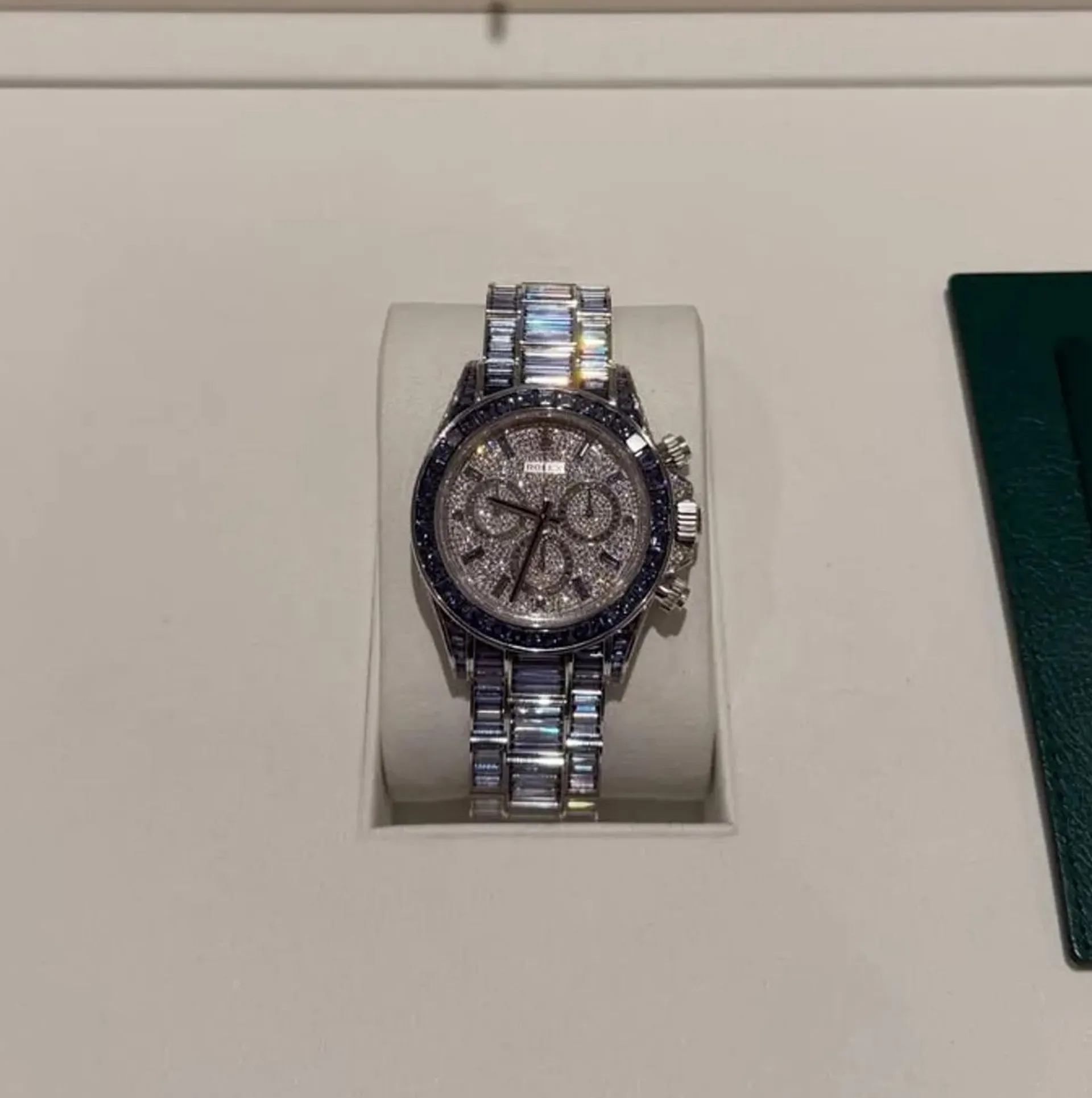Drake Rolex Ice Gradient Daytona bracelet — baguette-cut stones graduating from clear diamonds through pale blue to deep blue sapphires, fully factory-set by Rolex