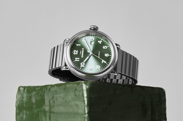 Shinola Detrola Cypress Green 2026 — deep green sunray dial with alabaster numerals and brushed silver brick-link bracelet