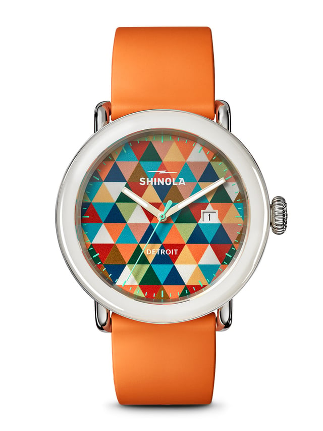 Shinola Detrola Color Theory Warm 2026 — front view of the 3D-printed orange-palette abstract dial with cream TR90 case and quick-release rubber strap